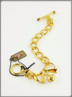 tag Authentic Juicy Couture gold plated bow started charm bracelet
