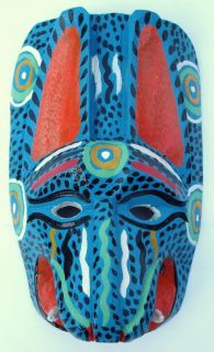 Carved from wood and hand painted the mask measures approx. 24 cm