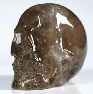 This is a Smokey Quartz Rock Crystal skull. Its 2.4 inches long from