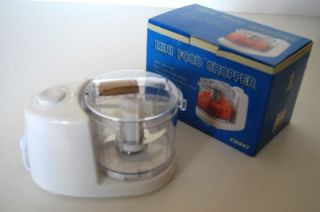 This clever little gadget is the  Mini Food Chopper, CH007. It