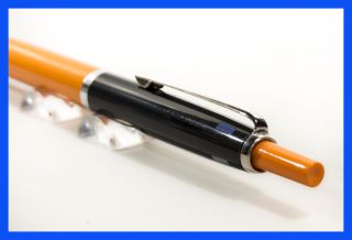 Farb Kugelschreiber in Schwarz und Orange, 60er   70er J. four color